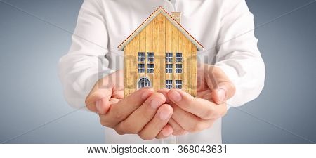 House Residential Structure In Hand.  Concept Of Investment Propert And Finance Investment Concep