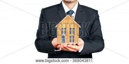 House Residential Structure In Hand.  Concept Of Investment Propert And Finance Investment Concep