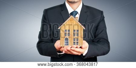House Residential Structure In Hand.  Concept Of Investment Propert And Finance Investment Concep