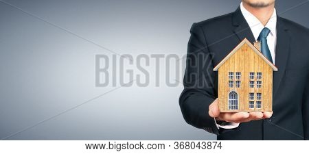 House Residential Structure In Hand.  Concept Of Investment Propert And Finance Investment Concep