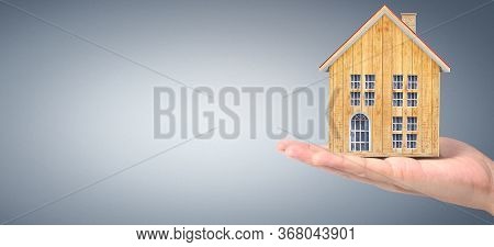 House Residential Structure In Hand.  Concept Of Investment Propert And Finance Investment Concep