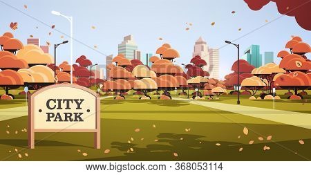 Sign Board In Autumn City Park Skyline With Yellow Leaves Falling In Sunlight Skyskraper Buildings C