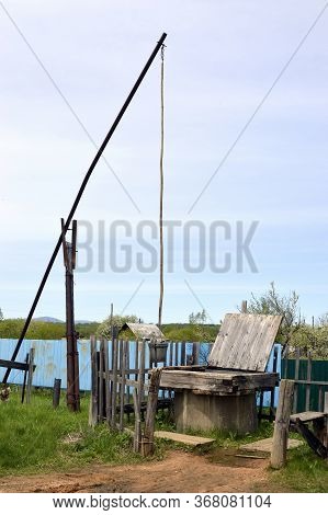 Unique Old Russian Well Named Shadoof (or Shaduf) In Countryside On A Summer Day