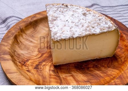 Pieces Of Cheese Tomme De Montagne Or Tomme De Savoie Made From Cow Milk In French Alps.