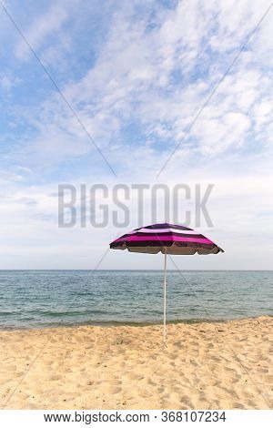 Vacation with shade with umbrella at the beach