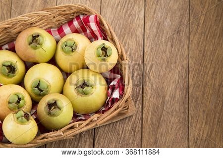 Rose Apple - Syzygium Jambos. Wood Background