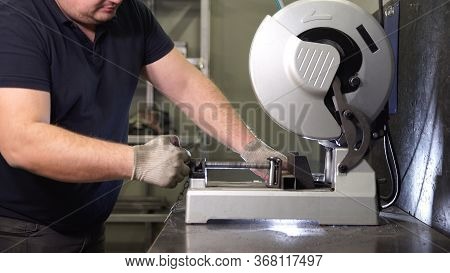 Hand In Gloves At Grinding Machine. Sawing Metal. Male Hard Work Concept.