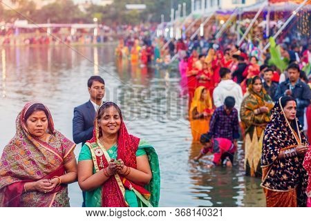 Kathmandu,nepal - November 1,2019: Hindu Devotees Offering Prayers To Sun God Standing In Water Acco