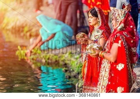 Kathmandu,nepal - November 1,2019: Hindu Devotees Offering Prayers To Sun God Standing In Water Acco