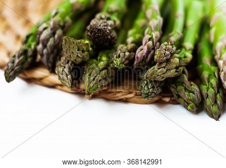 Bunch Of Fresh Raw Asparagus On White Background, Vegetarian Concept. Green Grass Sparrowgrass Stick