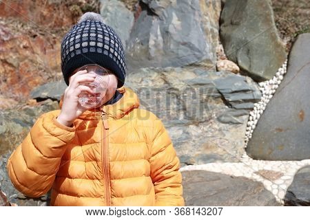 Child Drinking Mineral Water In Narzan Valley, Kabardino-balkaria, Russia