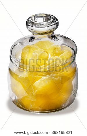 Dried Pineapple Candy Rings, In Powdered Sugar, Close-up Under Sunlight, Lying In A Transparent Glas