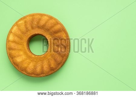 Homemade Cornmeal Cake On A Green Background. Flat Lay With Corn Bundt Cake. Festa Junina Traditiona