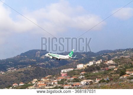 Madeira, Portugal - August 3, 2018: Plane Takes Off From Madeira Airport Runway.