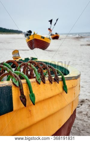 Fishing Boat On The Beach On A Cloudy And Foggy Day. Baltic Sea, Poland