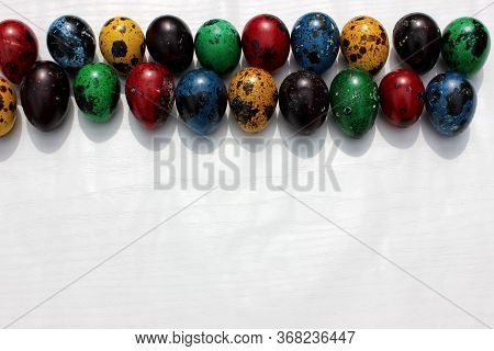 Frame Of Multi-colored Quail Eggs. Multi-colored Quail Easter Eggs On A White Background. Multi-colo