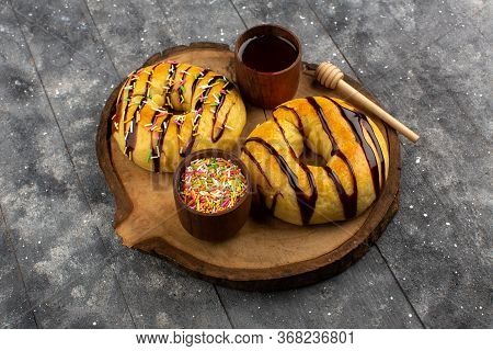 A Top View Yummy Donuts Sweet Delicious On The Brown Wooden Desk And Grey Floor