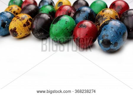 Frame Of Multi-colored Quail Eggs. Multi-colored Quail Easter Eggs On A White Background. Multi-colo