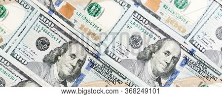 Close Up Of 100 Dollar Bills As A Background. Amarican Dollars Pattern. Top View Of Business Concept