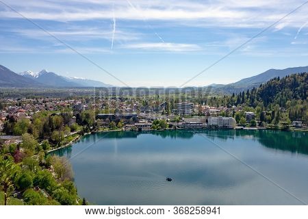 The Hotels And Commercial Buildings In Bled, Slovenia With A Blejsko Jezero (bled Lake) In The Foreg