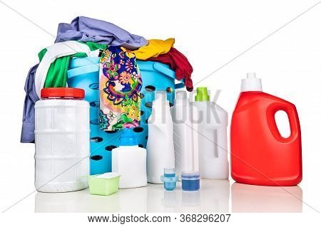 Various Format Of Powder And Liquid Laundry Detergent With Scooper And Laundry Basket Against White 