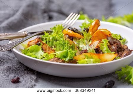 Salad With Chicken Liver, Fresh Lettuce And Caramelized Pear.