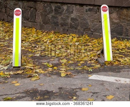Foldable Street Bollards. No Parking And No Entrance Posts. Delineators. Stop Sign. Asphalt Covered 