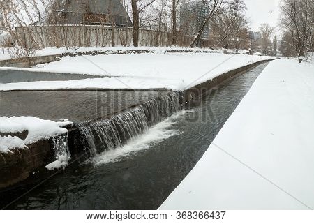 Urban Streams In Winter. The Lybid River (kyiv, Ukraine) In The Snow.