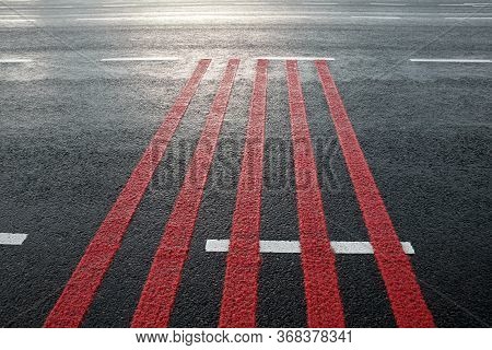 Red Rumble Strips On The Road. Sleeper Lines, Alert Strips, Audible Lines, Sleepy Bumps. Wake Up Cal