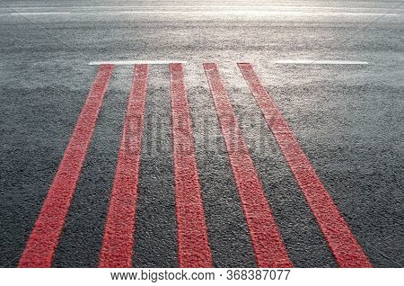 Red Rumble Strips On The Road. Sleeper Lines, Alert Strips, Audible Lines, Sleepy Bumps. Wake Up Cal