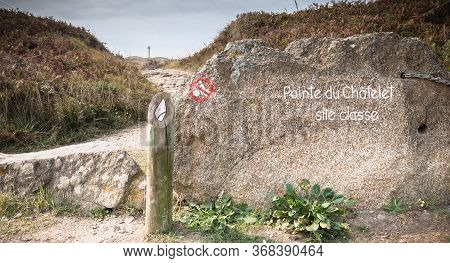 Pointe Du Châtelet Classified Site Written In Paint On A Stone At The Entrance Of A Path On The Isla
