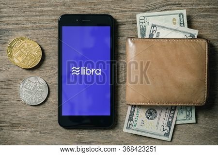 Chiangmai, Thailand - June 27th, 2019: Smartphone With Libra Logo On The Screen And Cryptocurrency D