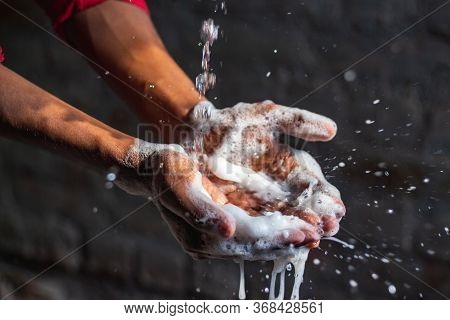 Washing Hands.man Washing His Hands In The Garden At Home. Corona Virus Pandemic Prevention Wash Han