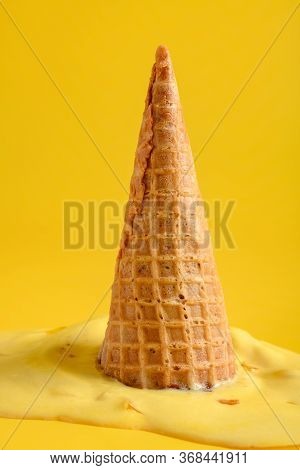 Side View Durian Flaor Ice Cone Melted On A Yellow Background
