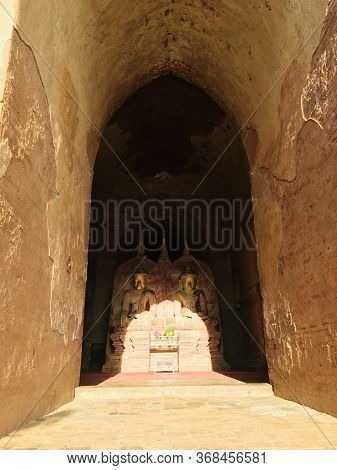Buddha Image In The Shadow, Statue And Architecture Burmese Fusion Style At Dhammayangyi Temple In B