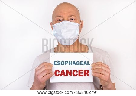 A Sick Man Holds A Tablet With The Text Esophageal Cancer. Medical Concept.