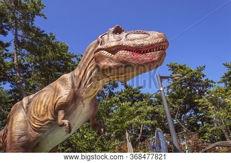 Busan, South Korea, September 14, 2019: Sculture Of Tyrannosaurus In Amnam Park On Sunny Day