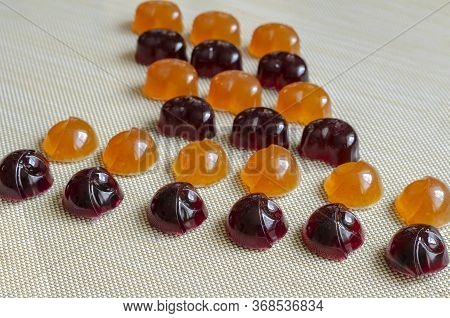 Homemade Gelatin Candies On A Beige Background. Jelly Candies With Blueberries And Orange. Treats Wi