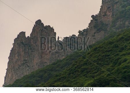 Wushan, Hubei, China - May 7, 2010: Wu Gorge In Yangtze River. Sharp Brown-black Rocky Mountain Peak