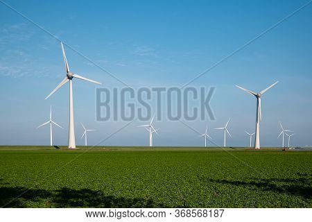 Windmill Park Westermeerdijk Netherlands, Wind Mill Turbine With Blue Sky In Ocean, Green Energy