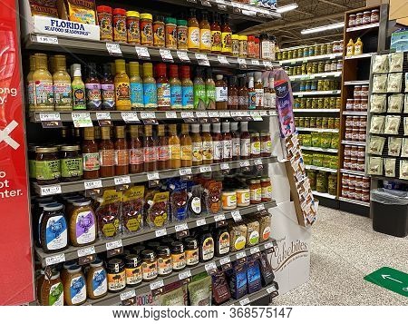 Orlando,fl/usa -5/6/20:  The Sauce Aisle Including Barbecue And Honey Marinades For Meat At A Public