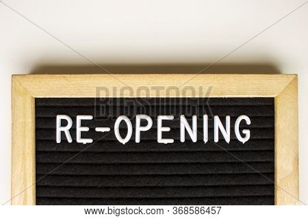 Re-opening, Text Message On A Blackboard With White Background