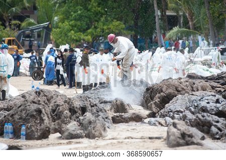 Rayong,thailand-february 8,2013 : Unidentified Workers And Volunteers Are Spraying Chemicals Onto Cr