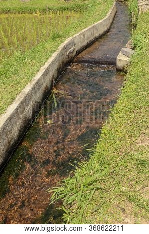 Irrigation Canal Called Subak, A Traditional Way Of Bringing Water To The Fields And Rice Terraces I