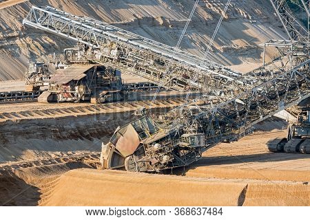 Brown Coal Open Pit Landscape With Enormous Digging Excavator In Hambach Mine Germany, This Machine 