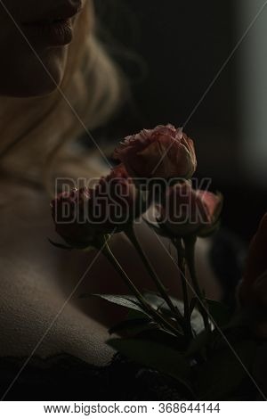 View Of The Female Neck, Collarbone And Shoulders With Flowers, Close-up, Silhouette