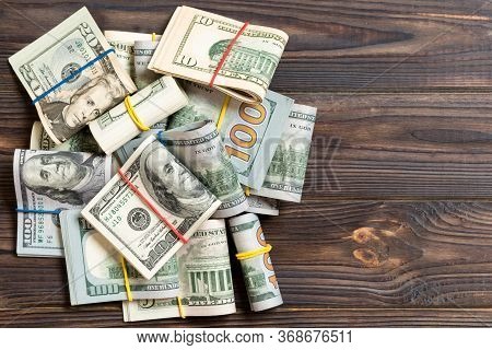 Us Dollar Bills Bundles Stack. One Hundred Dollar Bills With Stack Of Money In The Middle. Top View 