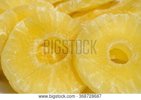 Dried Pineapple Candy Rings, In Powdered Sugar, Close-up In Sunlight.