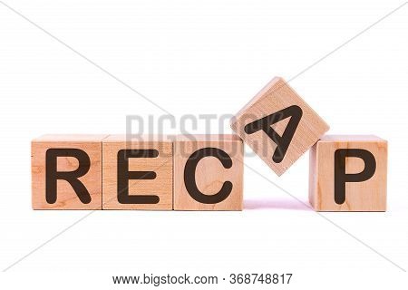 Word Recap Is Made Of Wooden Building Blocks Lying On The Table And On A Light Background. Concept.