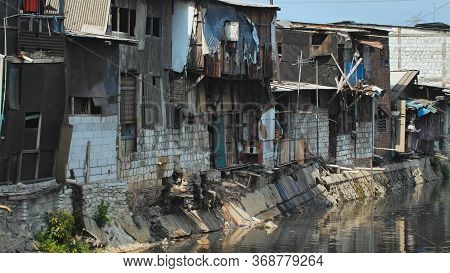 Slum Area On The Riverbank In Jakarta. Indonesia.